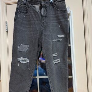 Woman Distressed Black Jeans with patches and ripped areas